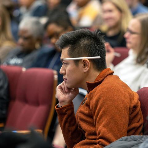 Man in audience listening