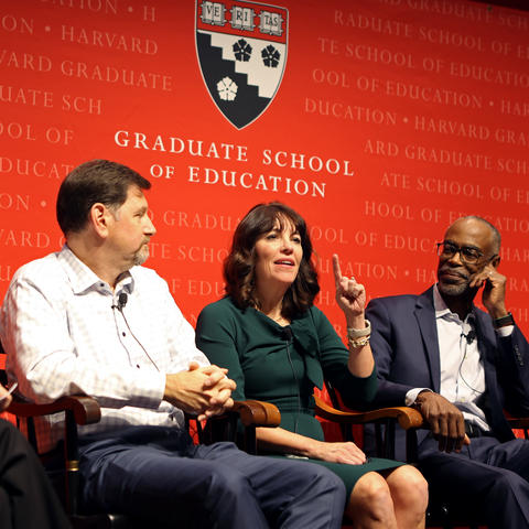 Ross Wiener, Kris Gilmore, and Bob Runcie sitting in front of the Harvard Graduate School of Education sign.
